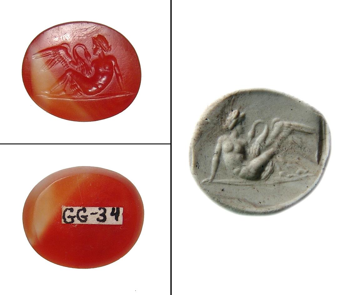 Gorgeous Roman ring stone depicting Leda and Swan: A gorgeous Roman ring stone depicting Leda and the Swan, c. 1st - 2nd Century AD, in rich orange carnelian, Leda beautifully carved in a long gown, the swan with incredible detail. 19 x 16 mm. Ex Wyma