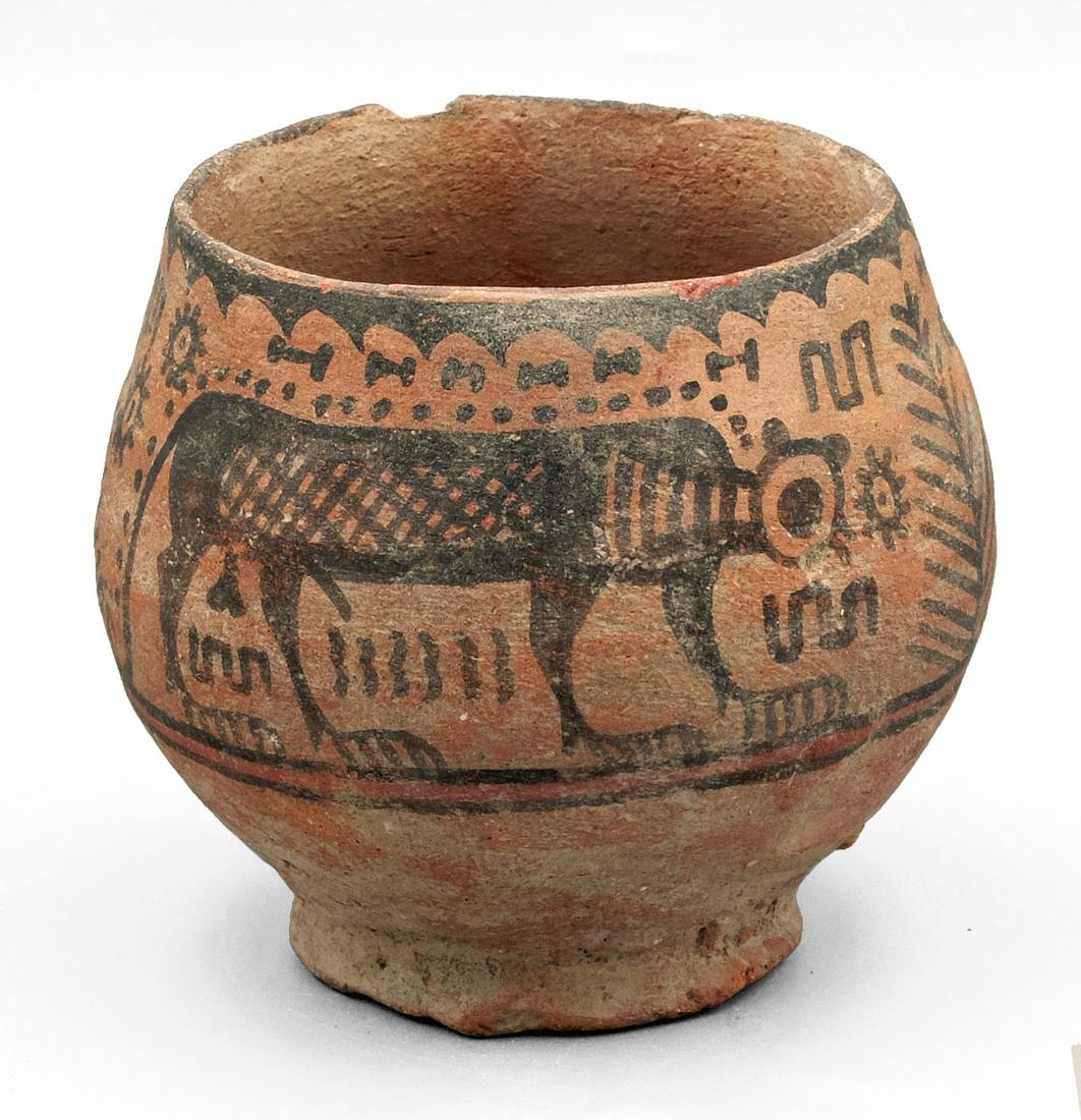 A choice Harappan cup from the Indus Valley: A choice Harappan cup from the Indus Valley, c. 2500 - 1800 BC, an excellent example elaborately decorated with a pair of felines, possibly tigers, separated by plants and surrounded by various symbol