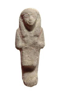 An Egyptian faience overseer or 'Reis' ushabti: An Egyptian faience overseer or 'Reis' ushabti, 3rd Intermediate Period, 21st Dynasty, c. 1080 - 945 BC, wearing tripartite headdress and characteristic kilt and triangular apron of everyday life, arm