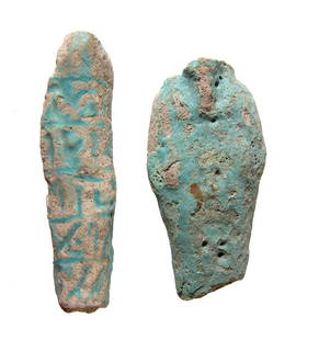 A pair of Egyptian ushabti fragments, Late Period: A pair of Egyptian ushabti fragments, Late Period, c. 664 - 332 BC, one a torso and the other the side of an ushabti with preserved partial registers of text. L: 2 7/8 in (7.4 cm). Both with