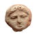 Greek terracotta roundel depicting face of a Gorgon