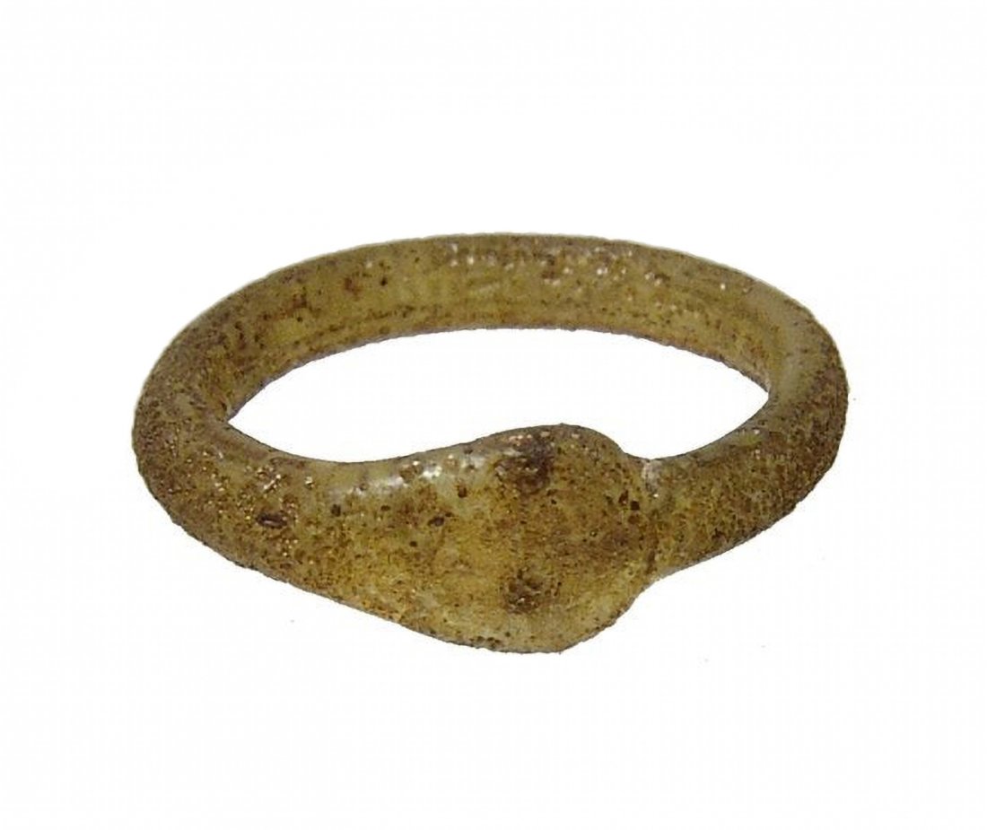 A Roman yellow glass child (1 of 3)