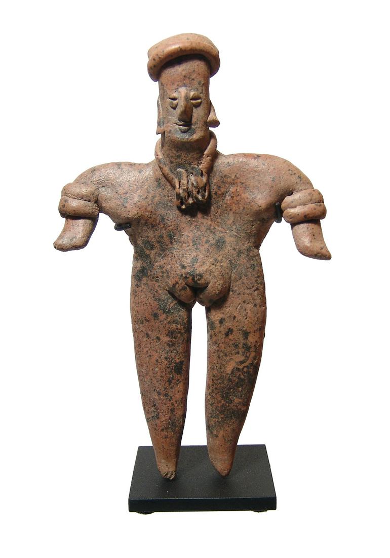 Colima figure of a standing woman, West Mexico: An attractive Colima figure of a standing woman, West Mexico, c. 100 BC - AD 250, depicted nude wearing a wrapped head piece, arm bands and a necklace with two large pendants or beads. Gorgeous mottle