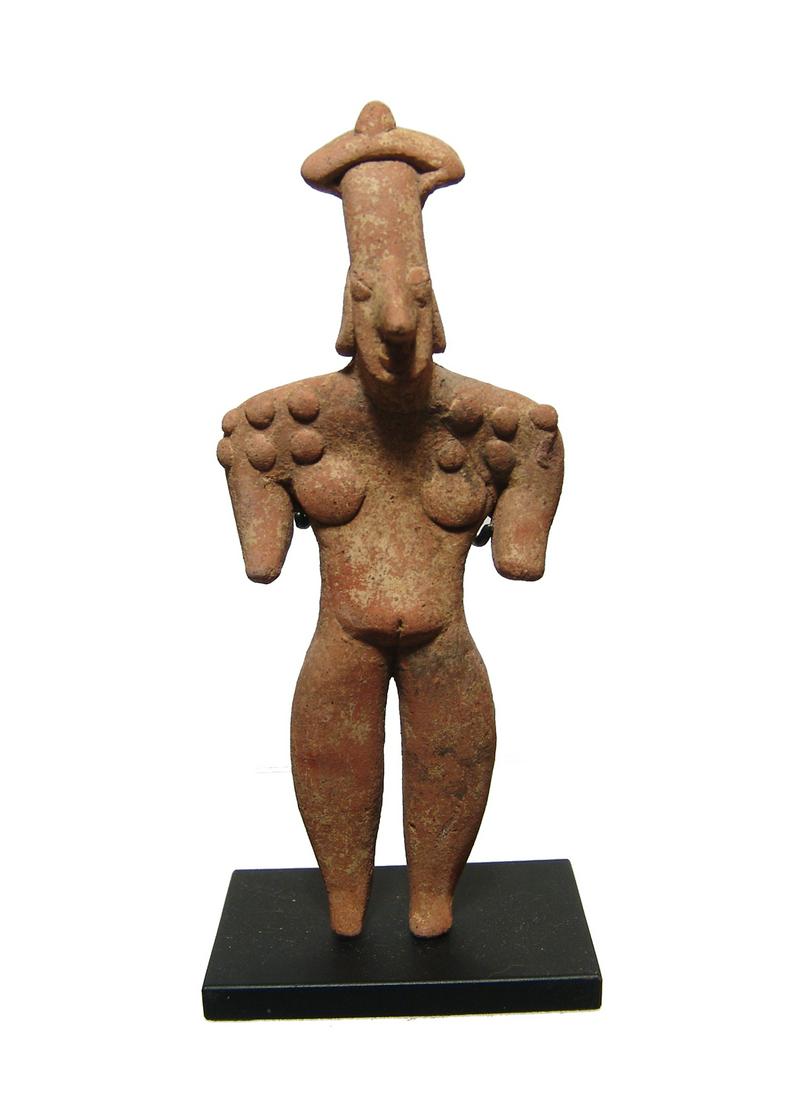 A nice Colima standing woman figurine: A nice Colima standing woman figurine, West Mexico, 100 BC - AD 250, depicted nude with wrapped headdress on her elongated head and earrings, her shoulder stippled with scarification marks. H: 5 1/8 i