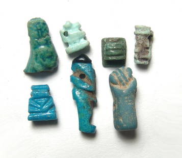 A group of 7 Egyptian faience amulets: A group of 7 Egyptian faience amulets. A mixed group, with most dating from the Late Period, c. 664 - 30 BC, and include stylized amulets of Bes, Pataikos a stamp seal and a nice head of a goddess.