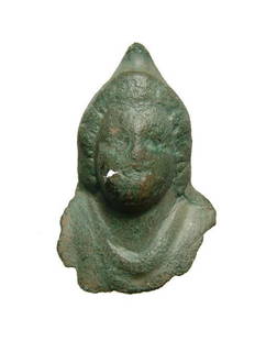 Roman bronze bust of a male wearing a Phrygian cap: A Roman bronze bust of a male wearing a Phrygian cap, c. 1st - 3rd Century AD, perhaps a depiction of the Phrygian deity Men or the Greek god Attis. His features are rounded with curls framing his