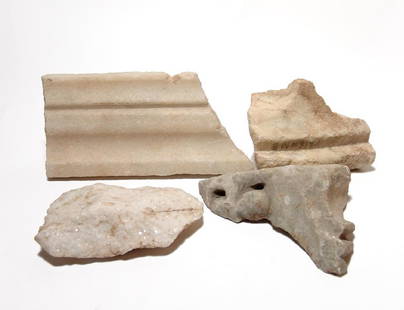 A group of 4 Roman marble fragments: A group of 4 Roman marble fragments, c. 1st - 4th Century BC, all architectural fragment showing nice carving, antique collection notations on the back of two gives the names of find sites Priene and