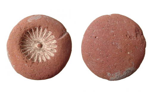 Egyptian terracotta floral/rosette mold, New Kingdom: An Egyptian terracotta floral/rosette mold, later New Kingdom, c. 1200 - 1075 BC, with traces of white paste still present. Used for making glazed composition elements for jewelry and tiles. Dia: 1