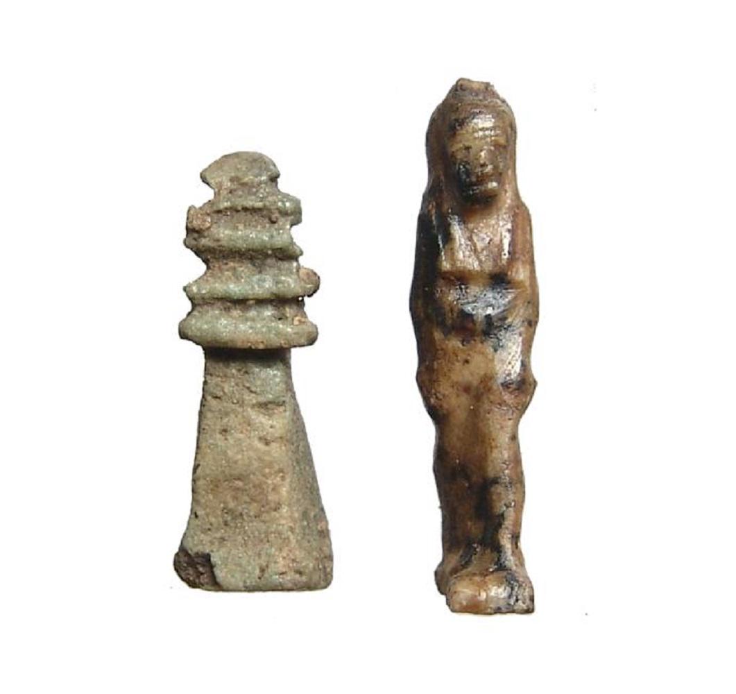 Pair of Egyptian amulets in lapis lazuli and faience: A pair of Egyptian amulets in Lapis Lazuli and faience, Late Period, c. 664 - 30 BC, the lapis amulet of the goddess Isis and a greenish faience Djed pillar amulet, Largest H: 1 1/8 in (2.7cm). Ex col