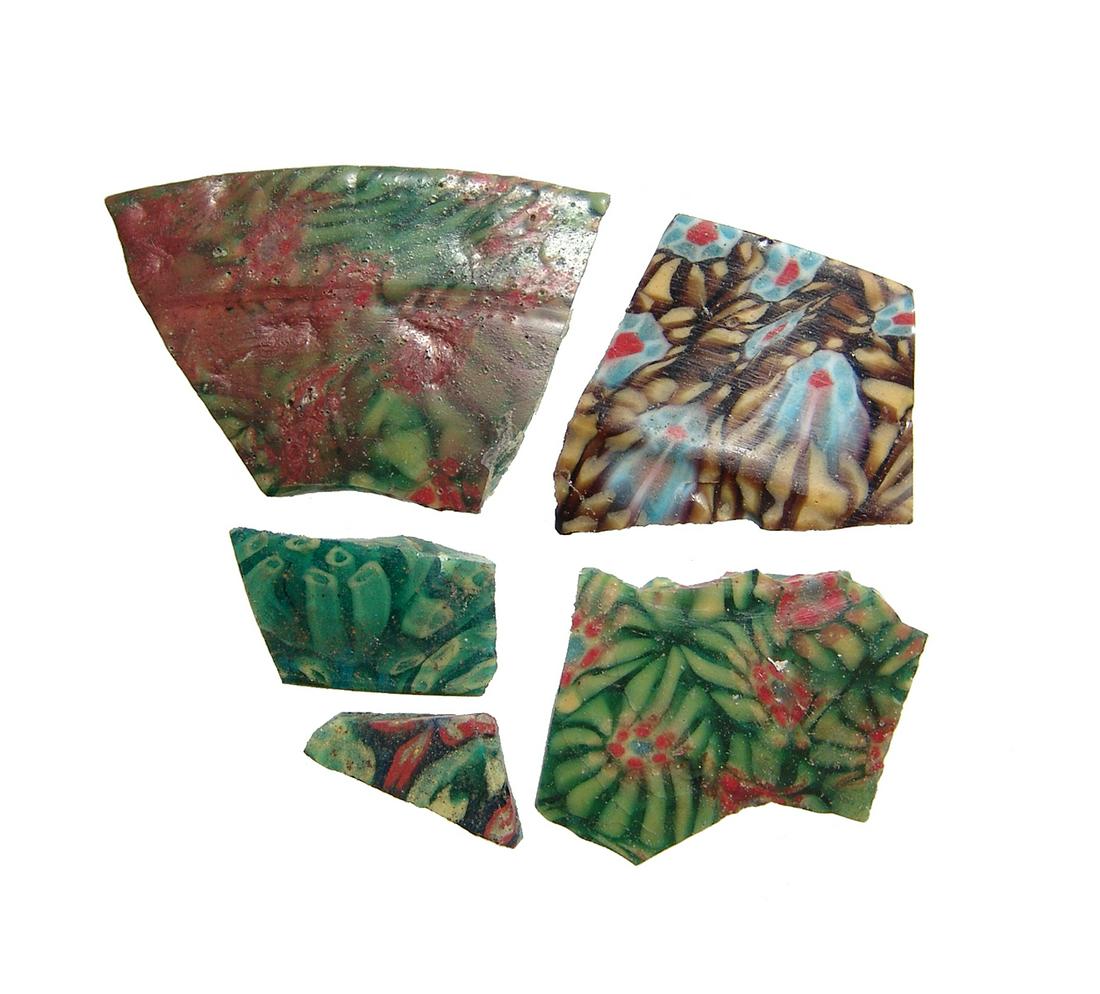 Group of 5 Romano-Egyptian mosaic glass fragments: A lovely group of 5 Romano-Egyptian mosaic glass fragments, 1st Century BC - 1st Century AD, two parts from a shallow bowl and the others from tiles or inlays. Each with colorful floral elements and q