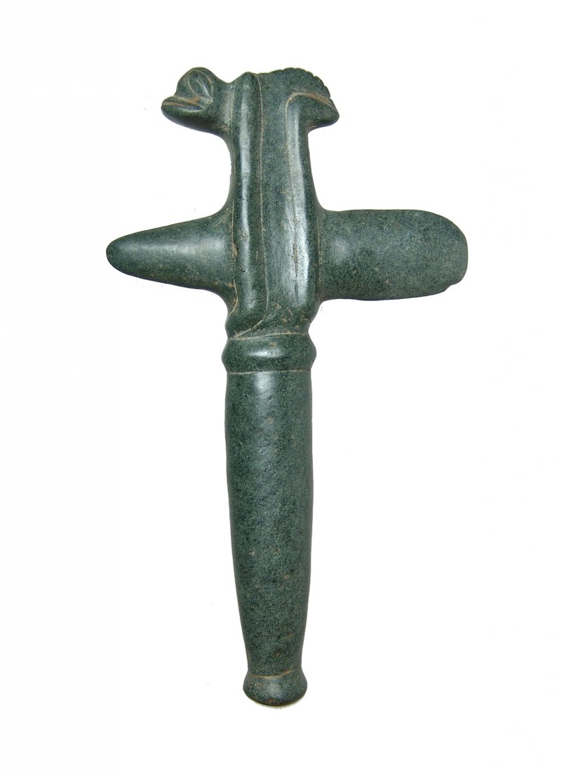 A nice Taino stone frog man axe: A nice Taino stone frog man axe, c. AD 1000 - 1500, carved from fine grained basalt. The frog has legs extending below the axe head. An axe such as this may have been made for a cacique's child as a c
