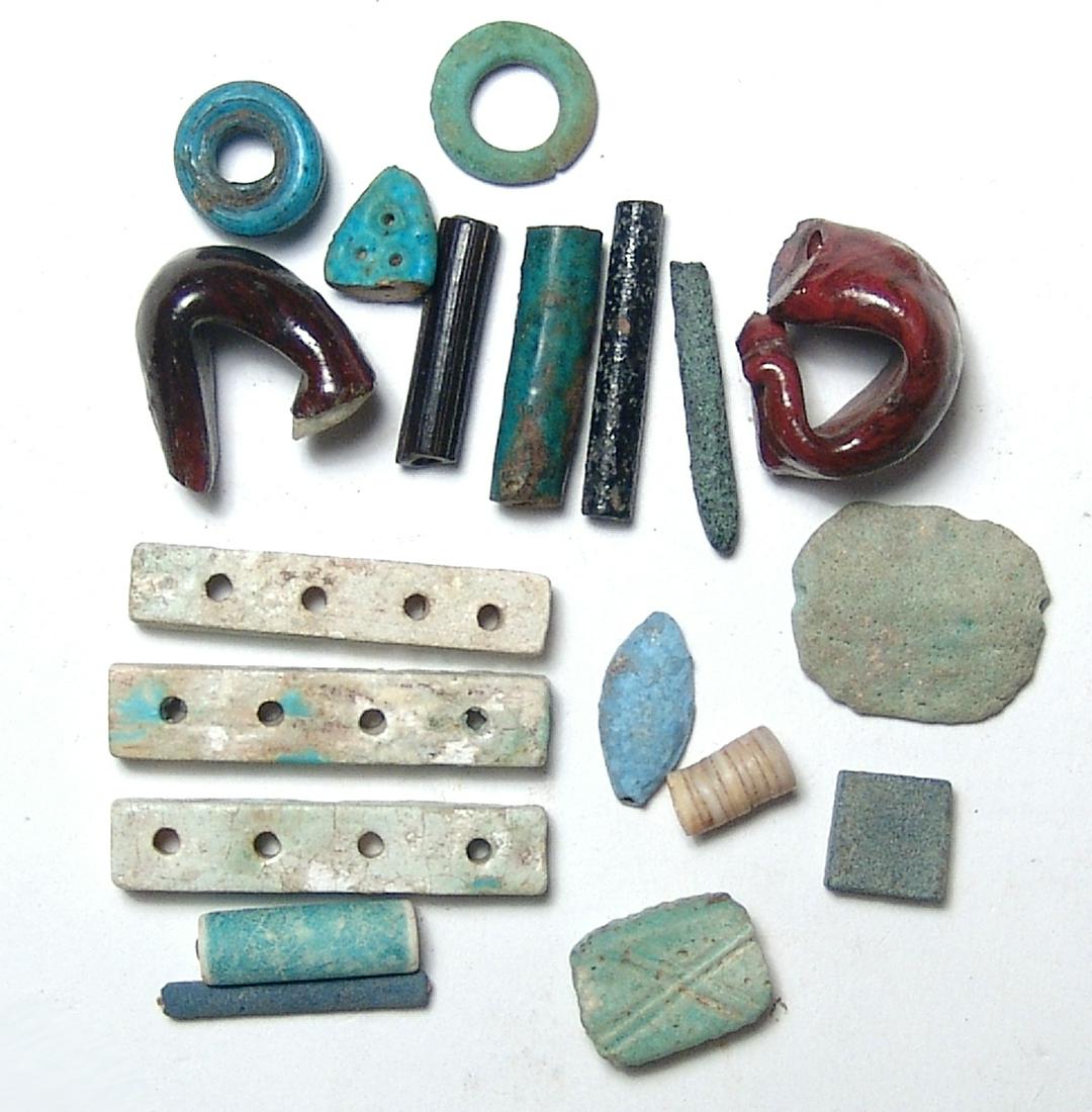 Group of mixed Egyptian faience and glass objects: A nice group of mixed Egyptian faience and glass objects. Lot includes Egyptian faience rectangular broad collar elements, Late Period, c. 664 - 30 BC, with four holes for stringing multiple strands a