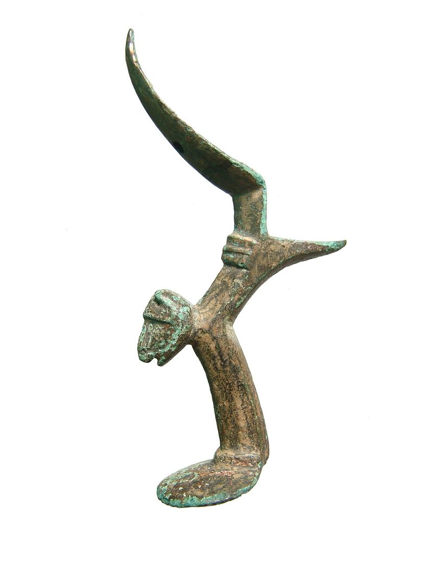 Late Roman/Byzantine bronze leg the form of a lion: A Late Roman/Byzantine bronze leg the form of a lion on its front paws, most likely from a tripod stand, c. 4th - 6th Century AD, the front paws forming a flat base, H: 4 4/5 in (12.2cm). Ex Joseph C.