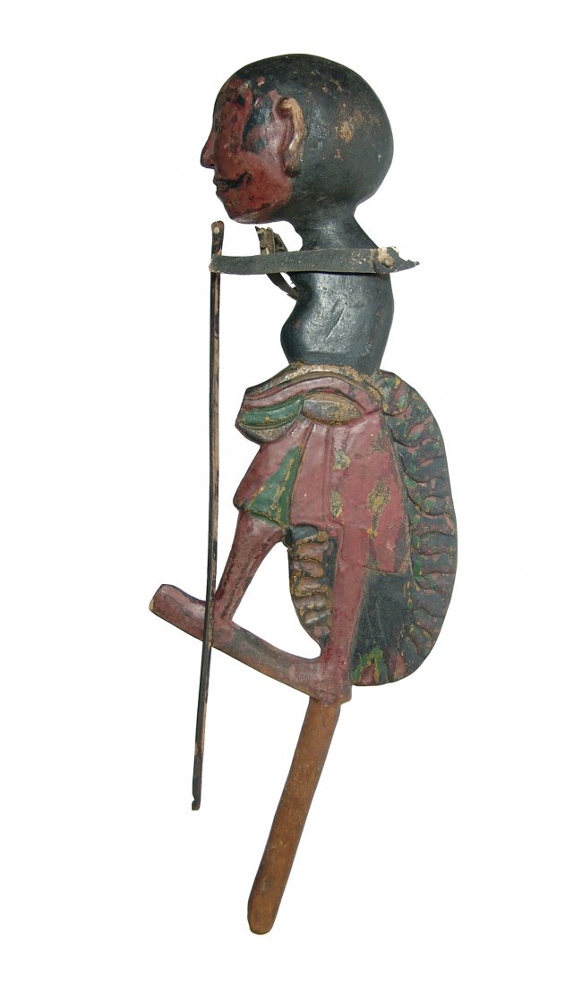 A wonderful wooden shadow puppet, Bali, Indonesia: A wonderful wooden shadow puppet, Bali, Indonesia, late 19th Century, depicting the Hindu monkey god, Lord Hanuman. Well preserved paint and remains of leather straps that controlled the hands. Clear 