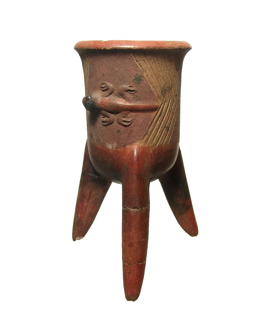 A nice El Bosque tripod vessel, Costa Rica: A nice El Bosque tripod vessel, Costa Rica, c. AD 400 - 700, the legs long and tapered, the body decorated with incised chevron-type panels opposite cute lizard adornos. H: 7 3/4 in (19.7 cm). A nice