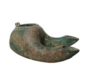 Late Roman/Byzantine bronze double nozzle oil lamp: A late Roman/Byzantine bronze double nozzle oil lamp, c. 5th - 6th Century AD, with hinge for original lid. The large fill-hole is bordered by ridges and the long nozzles have round profile and oval