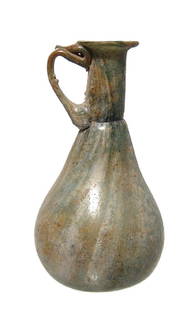 An attractive Roman green glass sprinkler vessel: An attractive Roman green glass sprinkler vessel with streaks of white glass, c. 4th Century AD, the body pear-shaped with deeply indented bottom, the neck constricted at base with flared mouth and