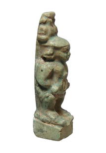 Charming Egyptian green faience amulet of Pataikos: A charming Egyptian green faience amulet of Pataikos, Late Period, c. 664 - 30 BC, a classic example, the bandy-legged dwarf depicted nude standing on a pair of crocodiles atop a square integral