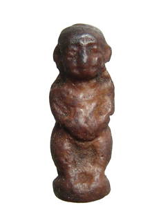 An Egyptian faience amulet of Pataikos, Late Period: An Egyptian faience amulet of Pataikos, Late Period, c. 664 - 332 BC, the bandy-legged dwarf standing on integral base, nude except for a wesekh, or broad collar, and with both hands on his belly,