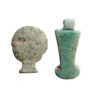 A nice pair of Egyptian amulets, Late Period: A nice pair of Egyptian amulets, Late Period, c. 664 - 30 BC, the first is a speckled granite amulet of the solar disk, 17 x 13 mm, the second a faience counterpoise amulet, with suspension loop. L: