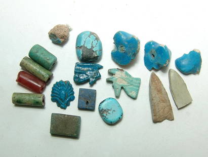 Mixed group of Egyptian faience objects, Late Period: A mixed group of Egyptian faience objects, Late Period, c. 664 - 30 BC, and includes a pair of Eye of Horus amulets, beads, and bead fragments, as well as a carnelian bead and a turquoise bead of a