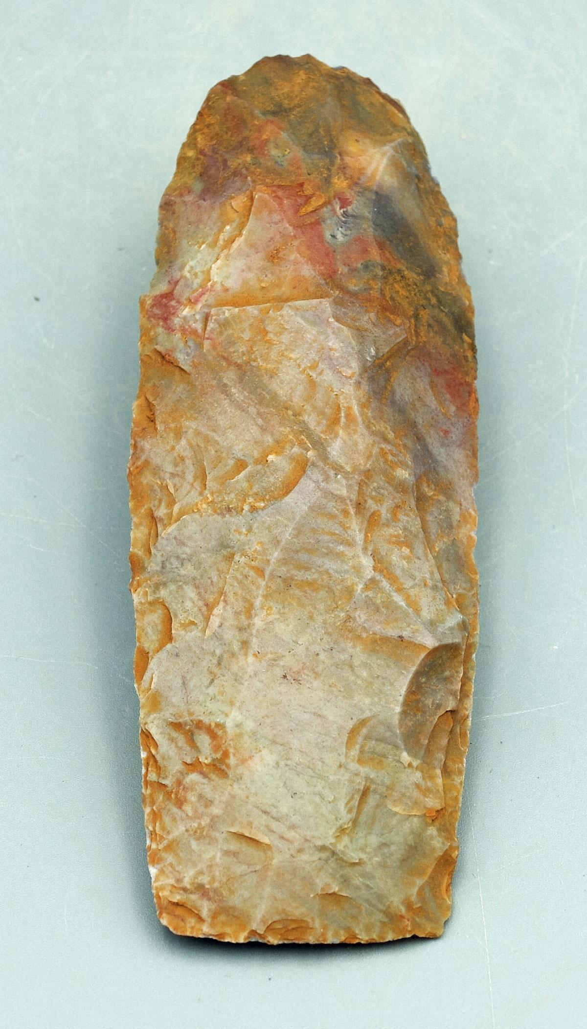 Beautiful Capsian culture Neolithic celt: Beautiful Capsian culture Neolithic celt, Maghreb region, Africa, c. 8000 - 2700 BC, a choice bi-facial example made from flint with red striations and has strong mineral deposits creating the lovely 