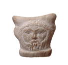 A fantastic Romano-Egyptian marble child's headrest