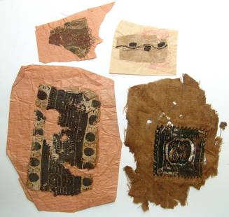 A group of 5 Coptic textile fragments, Egypt: A group of 5 Coptic textile fragments, Egypt, c. 5th - 7th Century AD. A variety of examples including a linen swatch with a square embroidered panel in wool, another panel with and interlocking scrol