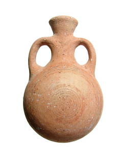 A Cypro-Archaic pilgrim's flask: A Cypro-Archaic pilgrim's flask, c. 750 - 600 BC, adorned with concentric bands on either side. The flared spout is flanked by two loop handles and the flask is a nice example of this classic and