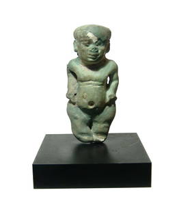 A large Egyptian faience amulet of Pataikos: A large Egyptian faience amulet of Pataikos, Late Period, c. 664 - 332 BC, depicted in his characteristic form as a nude dwarf, with detailed features and remnants of pale green glaze. H: 2 1/4 in