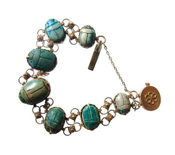 Beautiful antique gold bracelet with 7 Egyptian scarabs: A beautiful antique gold bracelet with 7 Egyptian scarabs. Six of the scarabs are ancient Egyptian and one is modern. Stand outs are a pair of late New Kingdom faience and steatite scarab with