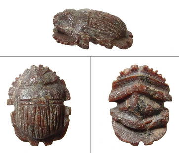 An Egyptian stone button scarab, Late Period: An Egyptian stone button scarab, Late Period, c. 664 - 30 BC, nicely carved in brown calcite with naturalistic style. L: 1 in (2.5cm). Ex North Yorkshire private collection.