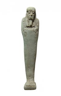 Egyptian faience ushabti, 30th Dynasty - Ptolemaic: An Egyptian faience ushabti, 30th Dynasty - Ptolemaic, c. 344 - 30 BC, on integral base and depicted mummiform, wearing tripartite wig and false beard, arms folded across chest, hands holding a pick