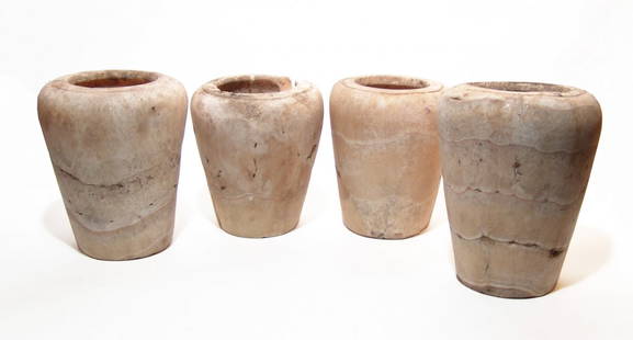 Set of 4 large Egyptian alabaster canopic jars: A set of 4 large Egyptian alabaster canopic jars, Late Period, c. 664 - 332 BC, each carved from a creamy stone with horizontal veins. Each jar is well-hollowed with a low ledge around the rim to fit