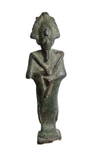 Rare Egyptian bronze figure of Osiris with Isis on back: A rare Egyptian bronze figure of Osiris, Late Period, c. 664 - 332 BC, mummiform and on integral base, wearing Atef crown with uraeus and false beard, arms folded at midsection and holding a crook