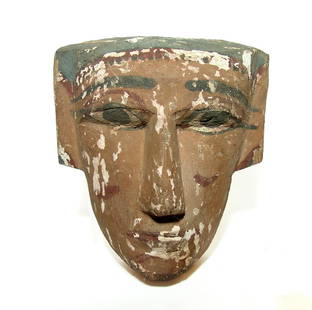 Large Egyptian wood 'mummy mask', Late Period: A large Egyptian wood 'mummy mask', Late Period, c. 664 - 332 BC, the facial portion from a sarcophagus lid with angular features and part of the headdress remaining. 12 x 9 in (30.4 x 22.8 cm). The