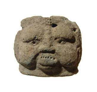 An Egyptian terracotta head of the god Bes: An Egyptian terracotta head of the god Bes, Late Period, c. 664 - 30 BC, with leonine features and hole atop the head for a headdress. Nice features remain and an interesting piece that appears to hav