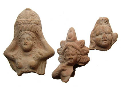 A trio of very nice Egyptian terracotta fragments: A trio of very nice Egyptian terracotta fragments, Ptolemaic, c. 332 - 30 BC, and include a handsome head from a Harpokrates figure wearing a large wreath and Double Crown, H: 3 1/8 in (8 cm),