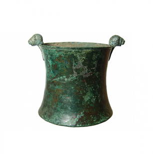 A choice ancient bronze cup with lion-headed knobs: A choice Greek bronze cup with lion-headed knobs, possibly Greek, c. 4th - 3rd Century BC or Achaemenid, c. 5th Century BC, with concave sides and ring foot, the rim with incised groove on the