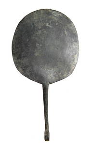 A Roman/Etruscan bronze mirror: A Roman/Etruscan bronze mirror, c. 3rd - 1st Century BC, fashioned from a single piece of metal, the circular mirror has been pounded flat with a long tapering handle which has been curled at the