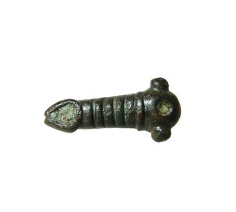 A Roman bronze phallic applique: A Roman bronze phallic applique, 1st - 3rd Century AD, with ribbed shaft, and areas for inlay; two mounting tabs on bottom. L: 3 cm. Nicely patinated. Ex Swiss private collection.