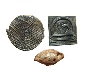 A Roman lead sling bullet and two other objects: A Roman lead sling bullet and two other objects. Lot includes a Roman lead sling bullet, c. 1st - 3rd Century AD, of characteristic shape with whistle holes, L: 1 1/4 in (3.2 cm), oxide patinated.