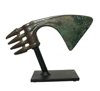 A wonderful Near Eastern bronze axe head: A wonderful Near Eastern bronze axe head, c. 1200 - 800 BC, cast as one piece with cylindrical shaft-hole with four straight ribs at the back terminating in four long conical points. The upper and