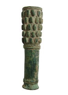 Near Eastern cylindrical bronze mace head: A Near Eastern cylindrical bronze mace head, c. 1200 - 800 BC, the uppermost portion decorated with oval domed bosses with divided ridges above and below and near the base of the shaft. L: 5 7/8 in