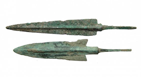 A pair of nice Near Eastern bronze javelin points: A pair of nice Near Eastern bronze javelin points, c. 1200 - 800 BC, each with pronounced midrib, one with tapered blade and the other leaf-shaped with barbed shoulders. The stems are quite