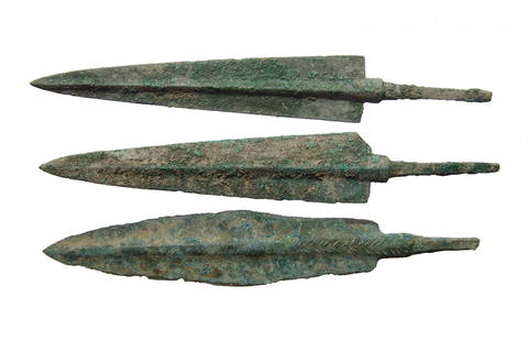 A lot of 3 nice Near Eastern bronze arrow points: A lot of 3 nice Near Eastern bronze arrow points, c. 1200 - 800 BC, each with pronounced midrib and tapered blade, the stems are quite substantial with tang for mounting into the shaft. Largest 6 in