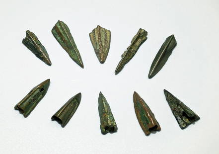 A group of 10 ancient bronze arrow points: A group of 10 ancient bronze arrow points, c. 3rd - 1st Century BC. The group consists of mostly Scythian and Greek trilobate types that range from 17 mm to 24 mm in length, all have a nice dark