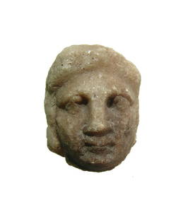 Medieval alabaster stone head of a man, European: A Medieval alabaster stone head of a man, European, 10th - 14th Century, with handsome features, the surfaces darkened from mineral deposits or from a fire. 2 3/8 x 1 3/4 in (6 x 4.4 cm). Ex