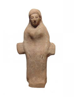 Greek terracotta votive of a goddess, possibly Demeter: A Greek terracotta votive of a goddess, possibly Demeter, 6th Century BC, depicted on a chair with arm rests protruding on either side. She wears a long chiton and himation and her facial features