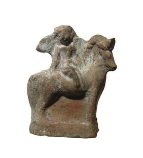 Hellenistic terracotta figure of Eros on horseback: A Hellenistic terracotta figure of Eros on horseback, c. 3rd - 2nd Century BC, the youth depicted winged and sitting side-saddle, his right hand resting on the animal's rump. 4 1/2 x 3 3/4 in (11.4 x